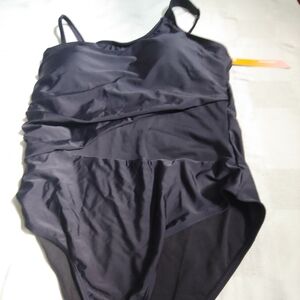 Mstuming one piece black swimsuit with sheer panel in front at the waist.